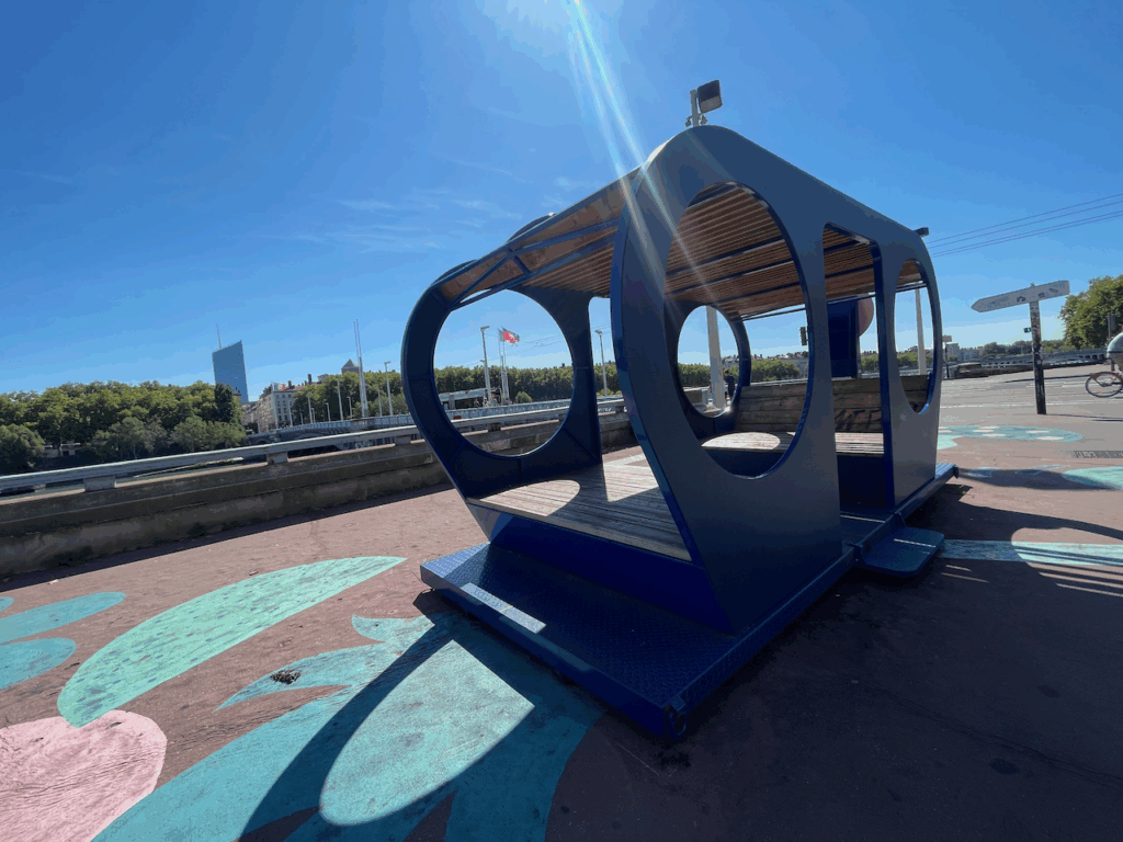 A decorative bench next to the river