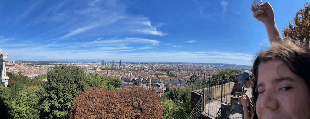 Lilian making a funny face at the camera while Kristian takes a photo