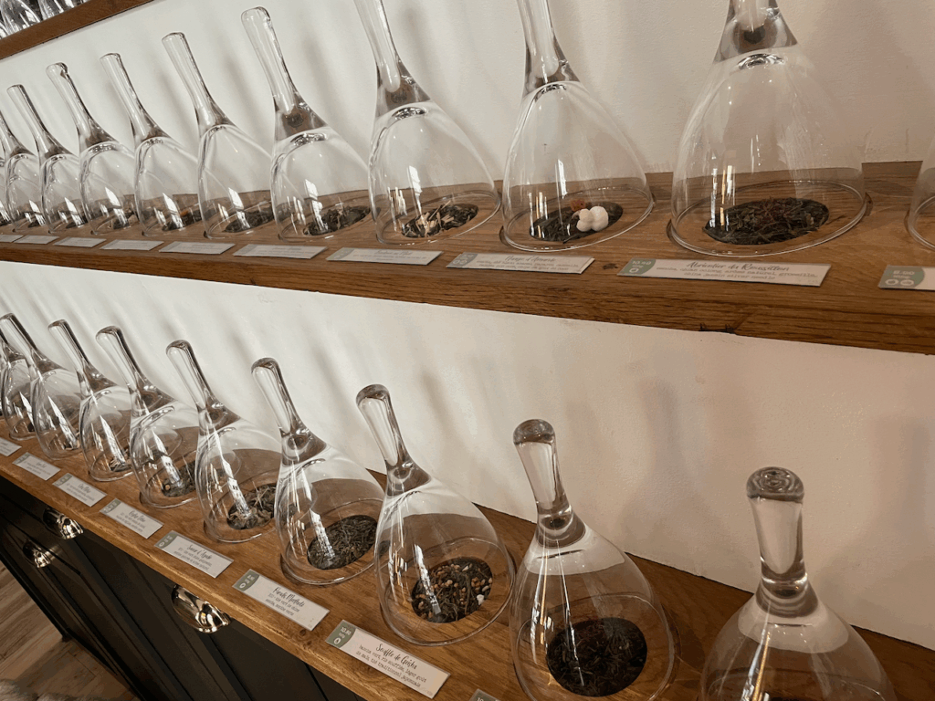 rows of tea samples under glass cloches