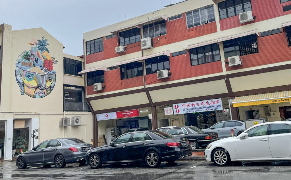 a street view with art on the side of a building