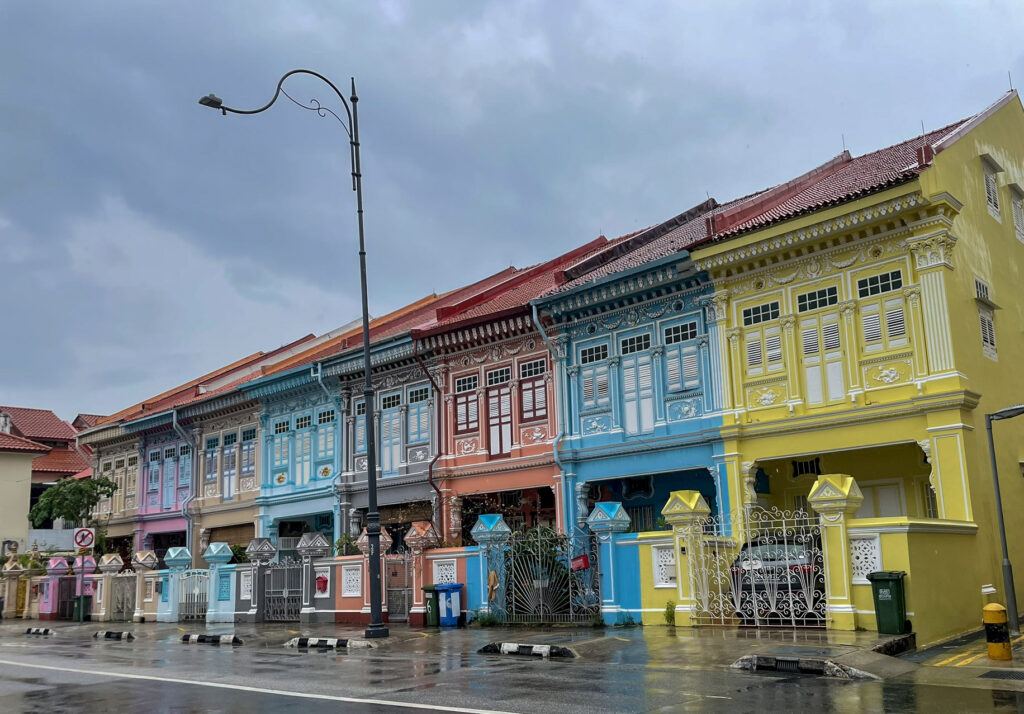 a row of houses painted in pastel colors
